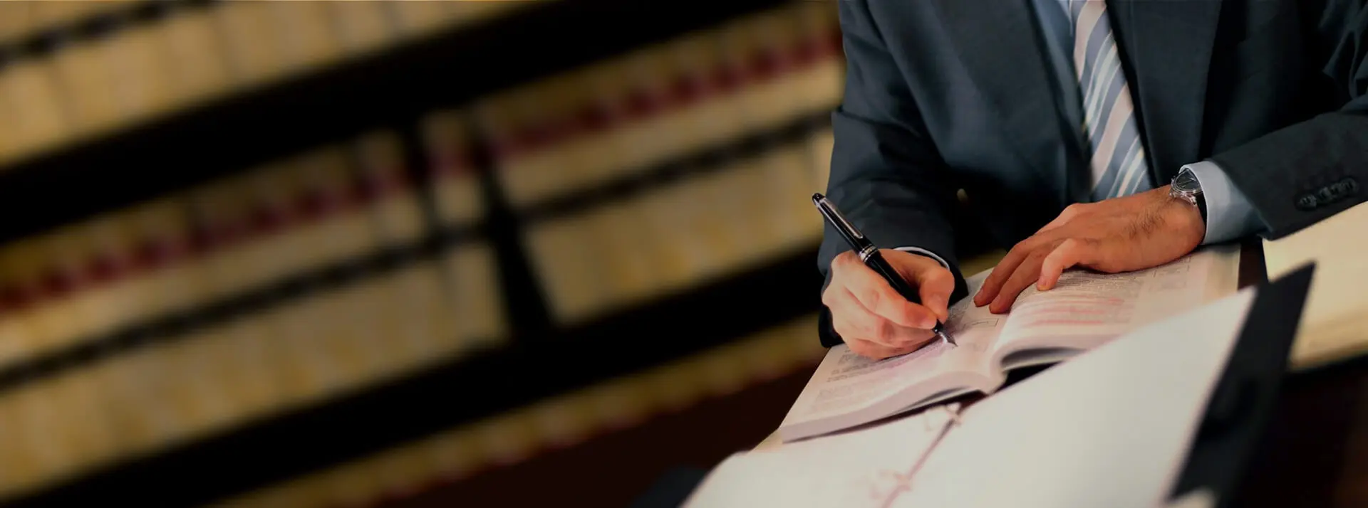 Lawyer Writing at Desk